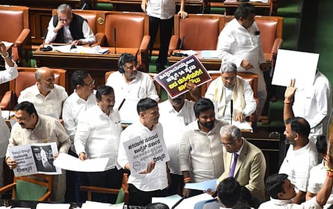 Opposition leaders in Karnataka Assembly protest against Valmiki board, MUDA and other scams by the state government