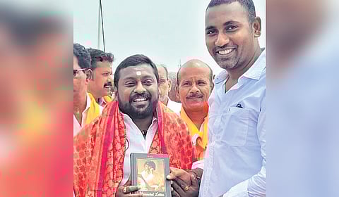 BJP cadre greeting SG Suryah