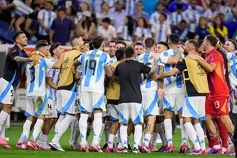 Players of Argentina celebrate defeating Ecuador in a penalty shootout in a Copa America quarterfinal soccer match in Houston, Thursday, July 4, 2024.