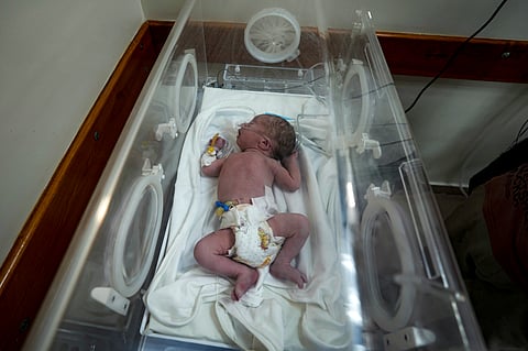 A Palestinian baby boy, not yet named, who was delivered prematurely after his mother Ola al-Kurd was killed in an Israeli strike, lies in an incubator at a hospital in Deir al-Balah, Friday, July 19, 2024