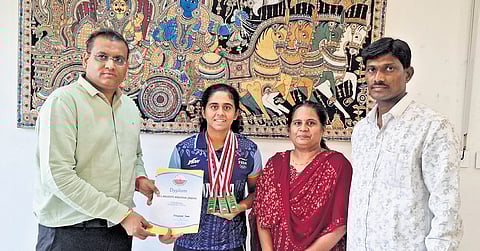 Nelakuditi Anusha with her parents.