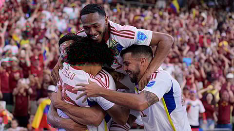 Venezuela's Eduard Bello, left, celebrates with teammates after scoring a second half goal during a Copa America Group B soccer match between Jamaica and Venezuela, Sunday, June 30, 2024, in Austin, Texas.