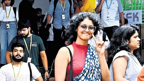 A group of delegates exits after a screening at the Kairali Sree Nila theatre complex