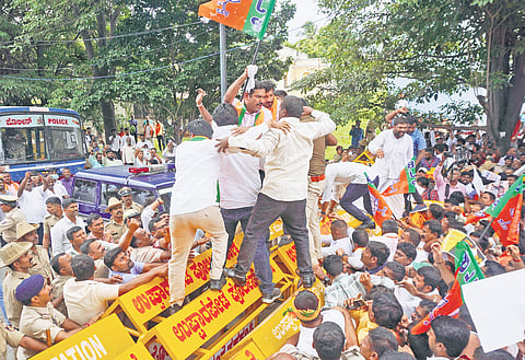 BJP leaders and workers led by state unit president BY Vijayendra protest against the Congress government over the alleged scams in the Karnataka Maharshi Valmiki Schedule Tribes Development Corporation Ltd and Mysuru Urban Development Authority, in Bengaluru on Thursday