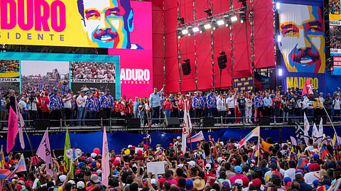 President Nicolas Maduro raises his fist during his closing election campaign rally in Caracas, Venezuela.