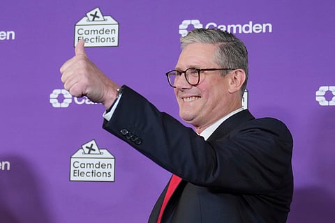 Britain's Labour Party leader Keir Starmer gives a thumbs up to his supporters after he was elected for the Holborn and St Pancras constituency, in London, Friday, July 5, 2024.