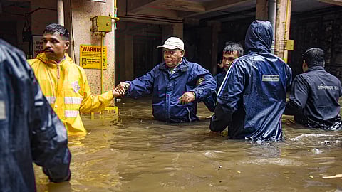 Locals being evacuated due to heavy waterlogging following incessant rains, in Pune on July 25, 2024.