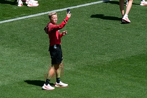 Coach Beverly Priestman of Canada takes photos on the pitch at Geoffroy-Guichard Stadium ahead of the 2024 Summer Olympics (Photo | AP)
