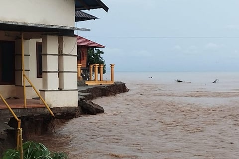 This photo shows erosion from floods threatening residential buildings following heavy rain in Bone Bolango regency, Gorontalo province.