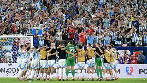 Argentina's players celebrate their team's victory in the Conmebol 2024 Copa America tournament semi-final football match between Argentina and Canada on July 9, 2024.