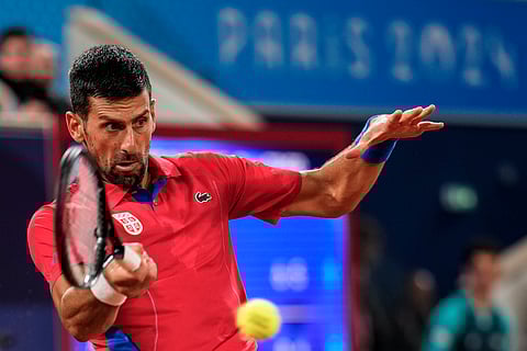 Novak Djokovic returns the ball against Matthew Ebden of Australia during the men's singles tennis competition at the 2024 Summer Olympics (Photo | AP)