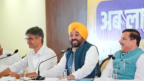 Punjab Chief Minister Bhagwant Mann along with AAP leaders Sanjay Singh and Sandeep Pathak addresses a press conference, in Chandigarh.