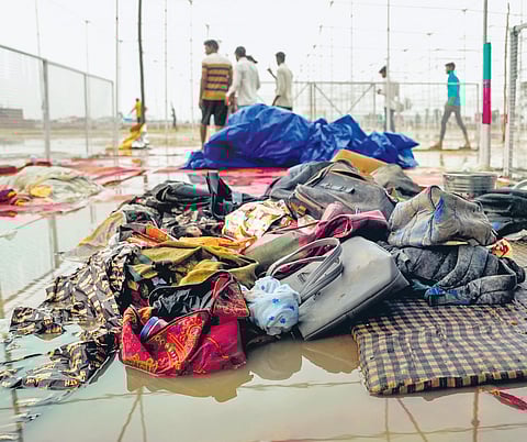 Bags and other belongings lying at the scene a day after a massive stampede that took place after a satsang in Sikandara Rao area in Hathras district of Uttar Pradesh, on Wednesday.