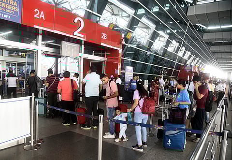 Flight passengers align at security check points in the Indira Gandhi International Airport of New Delhi on July 19, 2024 as airlines reported disruptions amid global IT outage. Five Indian airlines announced disruptions to their booking systems on July 19, matching widespread technical problems reported by flight operators around the world.