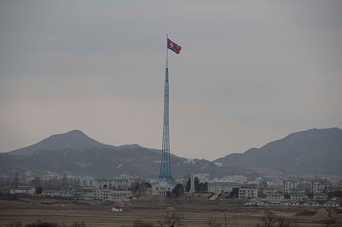 A North Korean flag flutters in North Korea's village Gijungdong as seen from a South Korea's observation post inside the demilitarized zone in Paju, South Korea during a media tour, March 3, 2023.