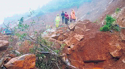 Rescue personnel at the landslide site at Shirur village in Ankola taluk of Uttara Kannada district on Sunday