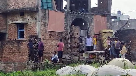 Security personnel and locals near the residence of Jitan Sahani, father of former minister Mukesh Sahani, after he was found dead, at Ghanshyampur in Darbhanga district.