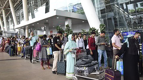 Passengers waiting in long queue at the Chennai airport after airline services were affected due to Microsoft outage.
