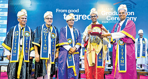 Professors and vice-chancellors present a memento to Ram Gopal, a global banking strategist and former CEO of Barclays Bank India, during the 15th graduation ceremony at Gitam University on Saturday