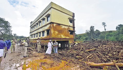 A building stands amid the destruction in landslide-hit Chooralmala village of Wayanad district on Wednesday