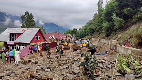 Debris being cleared from a road following a cloudburst, at Kangan area in Ganderbal district of Jammu and Kashmir