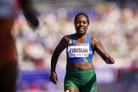 Sharon Firisua of the Solomon Islands, competes in the women's 100 meter run at the 2024 Summer Olympics, Friday, August 2, 2024, in Saint Denis, France.