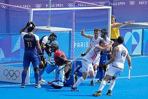 Belgium's John-John Dohmen, second right, celebrates after scoring his side's second goal during the men's Group B field hockey match between India and Belgium at the Yves-du-Manoir Stadium during the 2024 Summer Olympics