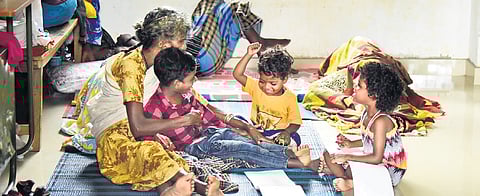 Tribal children with their grandmother at a relief camp at Kottanad UP School near Meppadi on Saturday