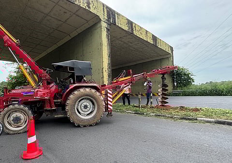 Drilling works to lay street lines in progress at the Container road