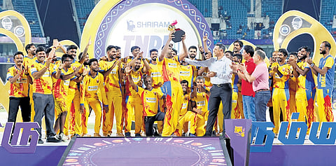 Former India head coach Rahul Dravid hands Dindigul Dragons captain R Ashwin the 2024 Tamil Nadu Premier League trophy in Chennai on Sunday