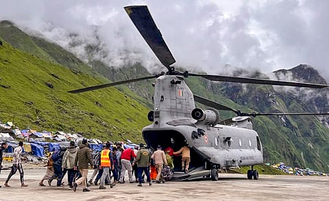 Pilgrims who were stranded on the rain-ravaged trek route to Kedarnath being airlifted, in Rudraprayag district, Monday, Aug. 5, 2024.