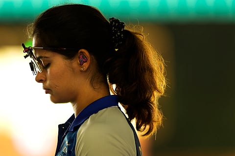 India's Manu Bhaker concentrates before shooting during the 25m pistol women pre-event training in Chateauroux, France, at the 2024 Summer Olympics, Thursday, Aug. 1, 2024.