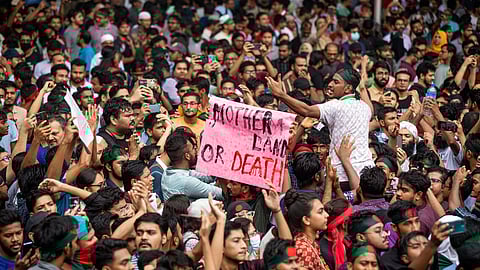 People participate in a protest march against Prime Minister Sheikh Hasina and her government to demand justice for the victims killed in the recent countrywide deadly clashes, in Dhaka, Bangladesh, Saturday, Aug. 3, 2024.