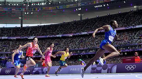 Grant Holloway, of the United States, wins a heat in the men's 110-meter hurdles at the 2024 Summer Olympics, Sunday, Aug. 4, 2024, in Saint-Denis, France.
