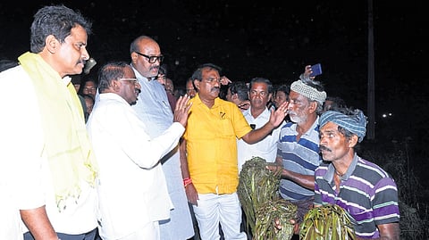 Agriculture Minister K Atchannaidu and Water Resources Minister N Ramanaidu inspecting the submerged crop fields in Godavari districts on Sunday
