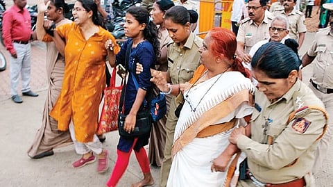 Police escort the protesting Lingayats