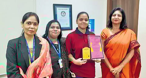 The Principal and staff of Orchids The International School presents Siddhita (second from right) with Girl Child Prodigy Award for the Bloom Riddhi Siddhi app.
