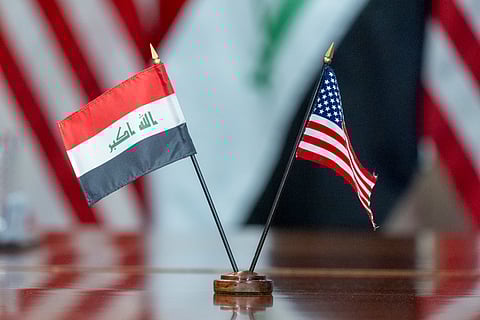The flags of Iraq and the United States are placed on the table during a meeting with Secretary of Defense Lloyd Austin meets and Iraqi Defense Minister Muhammad Al-Abbasi at the Pentagon.