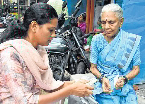 People receive pensions at their doorstep in Tirupati on Thursday.