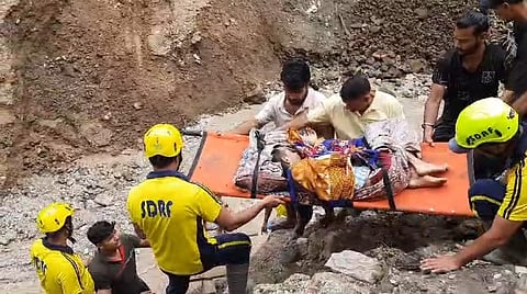 SDRF personnel rescuing stranded people after heavy rains hit several parts of Uttarakhand in the early hours of Thursday