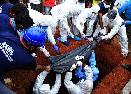 Mass burial of the unidentified bodies of landslide victims at the mass burial ground at Puthumala tea estate.