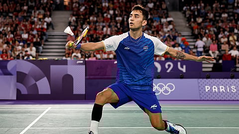 India's Lakshya Sen plays a shot against Denmark's Viktor Axelsen in their men's singles badminton semi-final match during the Paris 2024 Olympic Games.