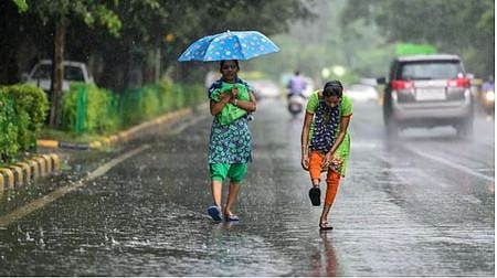 Pedestrians walking in the rain.