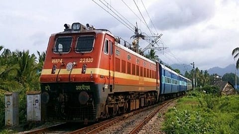 Passengers wait at a railway station in Kerala as Southern Railway estimates delays of up to one hour.