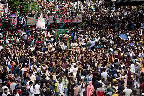 People shout slogans as they take part in a protest against Prime Minister Sheikh Hasina and her government demanding justice for the victims killed in the recent countrywide deadly clashes, in Dhaka, Bangladesh