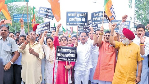 Delhi BJP leaders and workers stage a protest at the Tihar Jail entrance.
