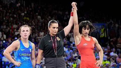 India's Vinesh Phogat, right, celebrates after defeating Ukraine's Oksana Livach during their women's freestyle 50kg quarterfinal wrestling match, at Champ-de-Mars Arena, during the 2024 Summer Olympics.