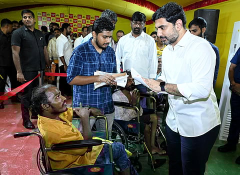 Minister for Education Nara Lokesh takes representations from the public during Praja Darbar on Tuesday.