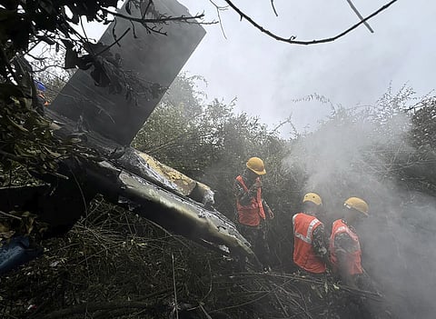 Rescuers work at the site of a helicopter that crashed in Suryachaur area, which is just northwest of Kathmandu, Nepal, Wednesday, August 7, 2024.