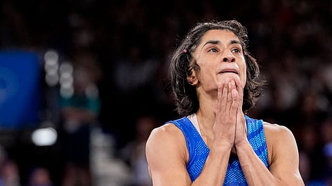 Vinesh Phogat reacts after the round of 16 of the women's freestyle 50kg wrestling match against Japan's Yui Susaki, at Champ-de-Mars Arena, in Paris, France, Tuesday, Aug. 6, 2024.